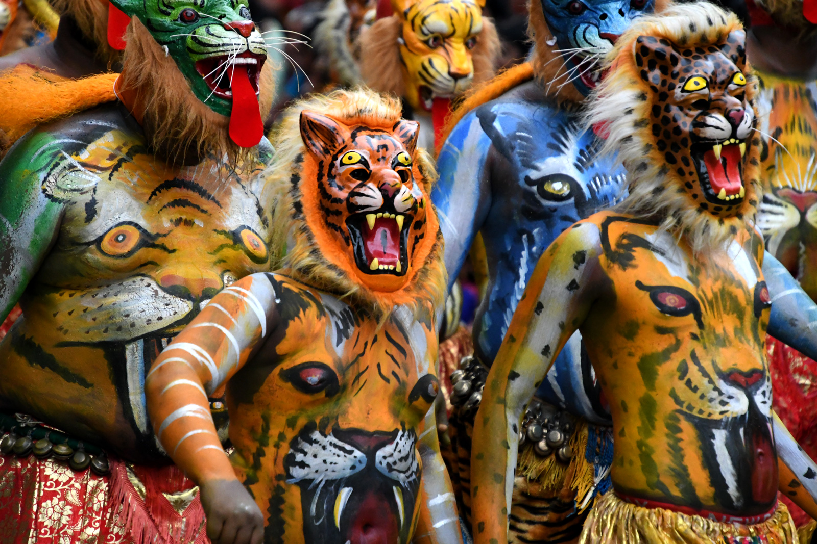 People dressed as tigers with body paint 
